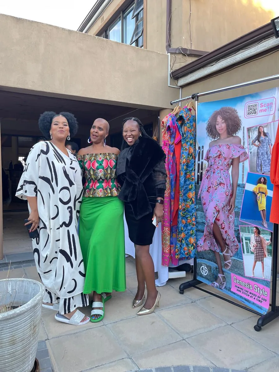 Women entrepreneurs celebrating together at a small business showcase in the Western Cape